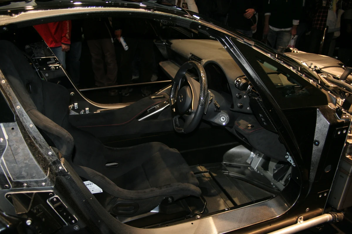 Exposed cabin and carbon-fibre structure of an LFA display car at the 2011 Tokyo Motor Show.